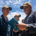 Sailors Aboard USS Dewey (DDG 105) Conduct Awards Quarters