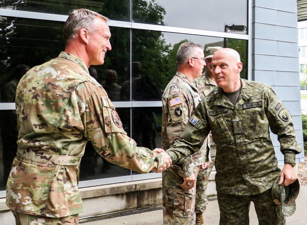 Kosovo commander greets 132d Wing operations group commander during international cyber exercise