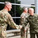 Kosovo commander greets 132d Wing operations group commander during international cyber exercise