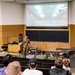 132d Wing operations group commander gives remarks at international cyber exercise