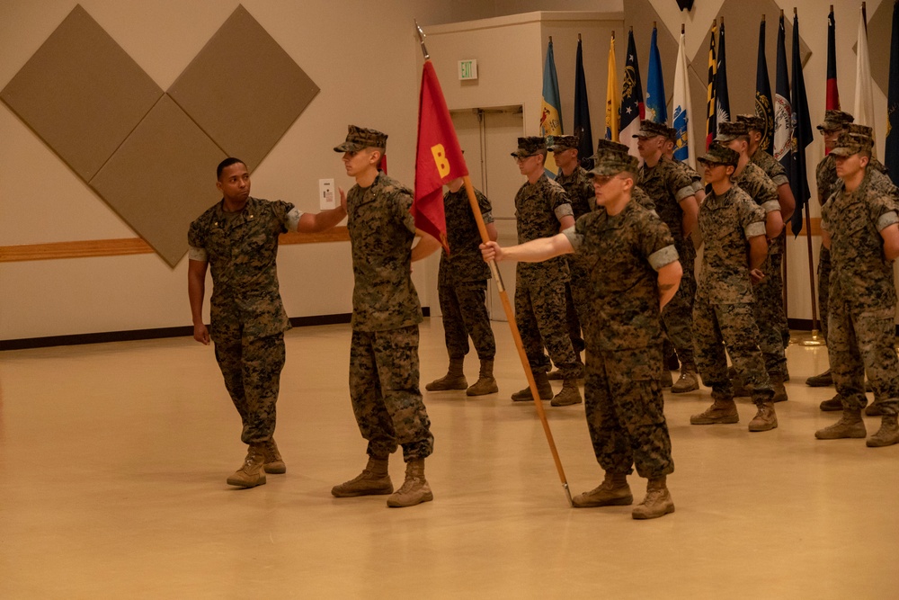 U.S. Marine Corps Capt. Jason Sander Presents Bravo Company Guidon to The New Company Commander