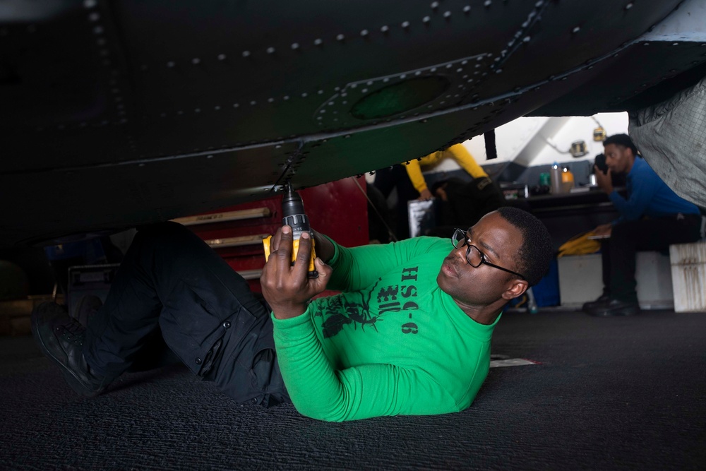 Sailor Removes Screws From Aircraft