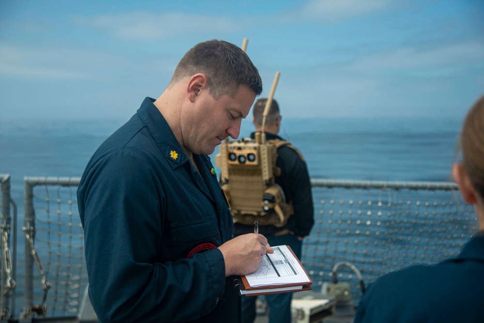 Naval Officer Evaluates Live Fire Exercise