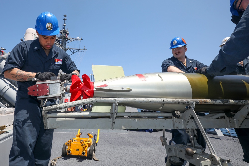 Sailors Load Torpedo