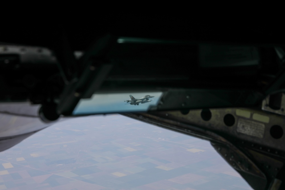 A Romanian F-16 Appears Behind An Alabama Air National Guard 117th Refueling Wing KC-135