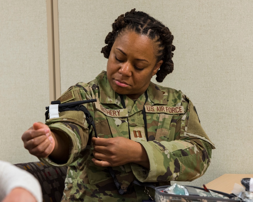 Students partake in medical simulations, tour base facilities