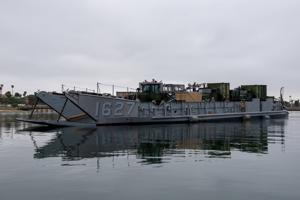 Landing Craft Utility pulls into boating dock