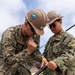 Sailors assigned to Assault Craft Unit One construct tents