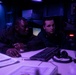Sailors Stand Watch in Combat Information Center Aboard USS Ralph Johnson (DDG 114)