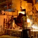 Foundry artisans pour liquid steel