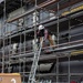 Civilian personnel set up support beams on the flight deck Nimitz-class aircraft carrier USS Carl Vinson