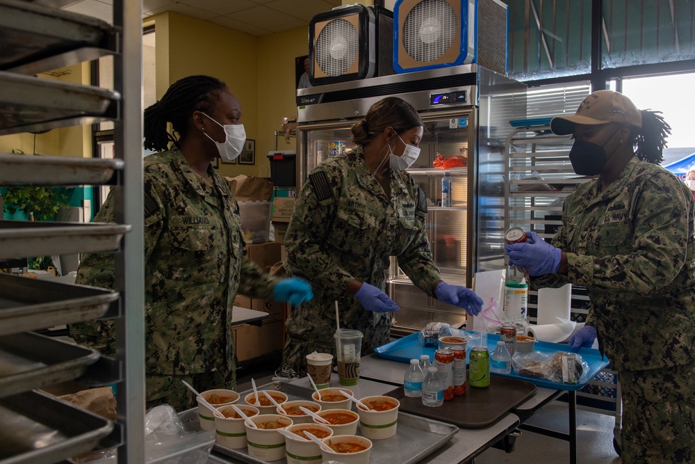 Sailors and Marines assigned to USS Portland volunteer