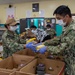 Sailors and Marines assigned to USS Portland volunteer