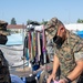 Sailors and Marines assigned to USS Portland volunteer