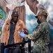 Sailors and Marines assigned to USS Portland volunteer