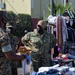 Sailors and Marines assigned to USS Portland volunteer