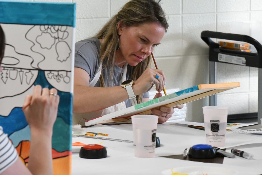 Fort Drum Family Advocacy Program staff helps community members to paint stress away