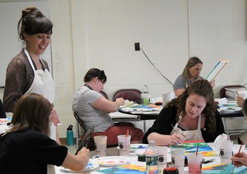 Fort Drum Family Advocacy Program staff helps community members to paint stress away