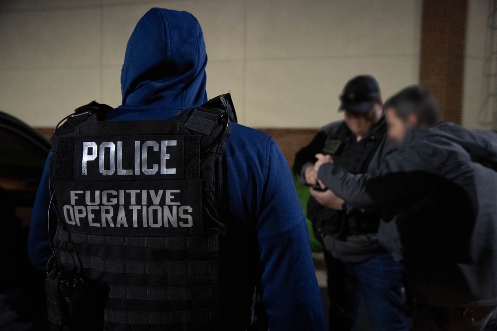 ICE Enforcement and Removal Operations (ERO) deportation officers effect an arrest