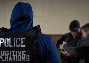 ICE Enforcement and Removal Operations (ERO) deportation officers effect an arrest