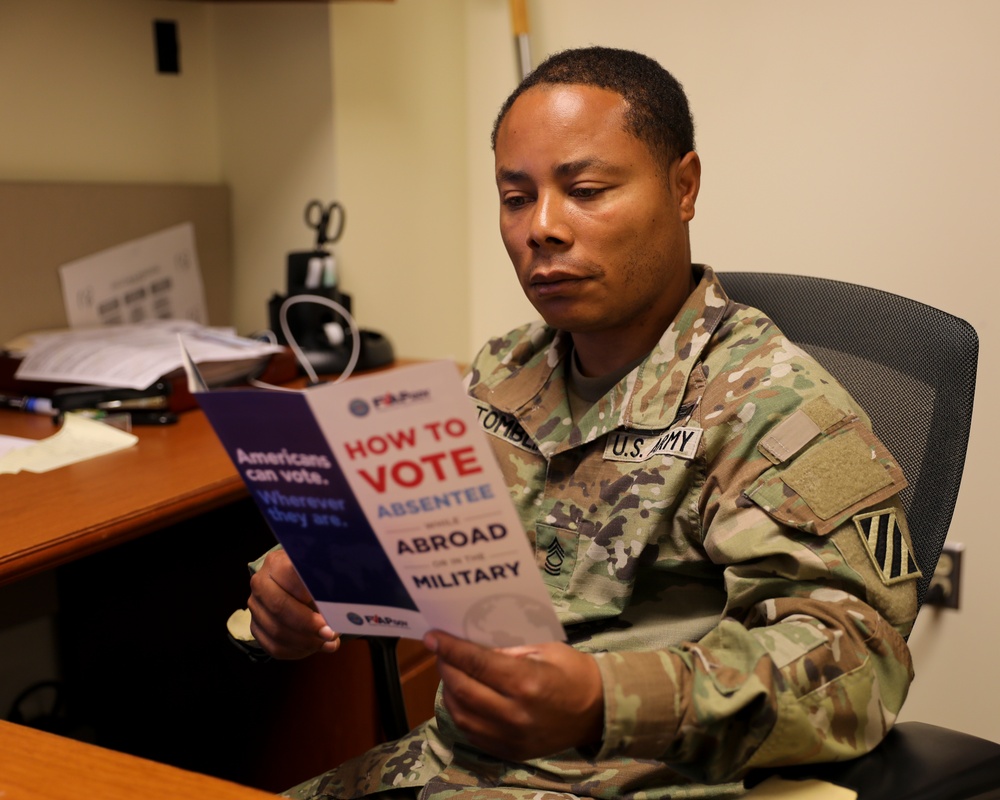Dogface Soldier reads FVAP brochure