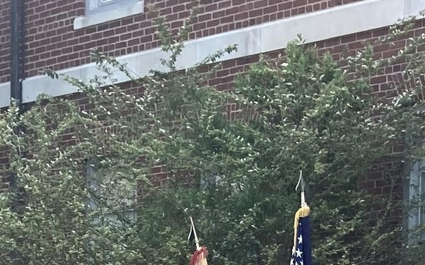 Soldiers from the 900th CBN uncase their colors