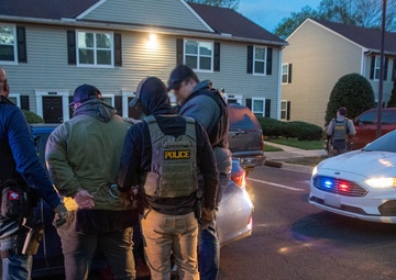 ICE Enforcement and Removal Operations (ERO) deportation officers effect an arrest during a vehicle stop