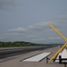 Last Steps: Airmen Check Runway for Debris prior to Reopening