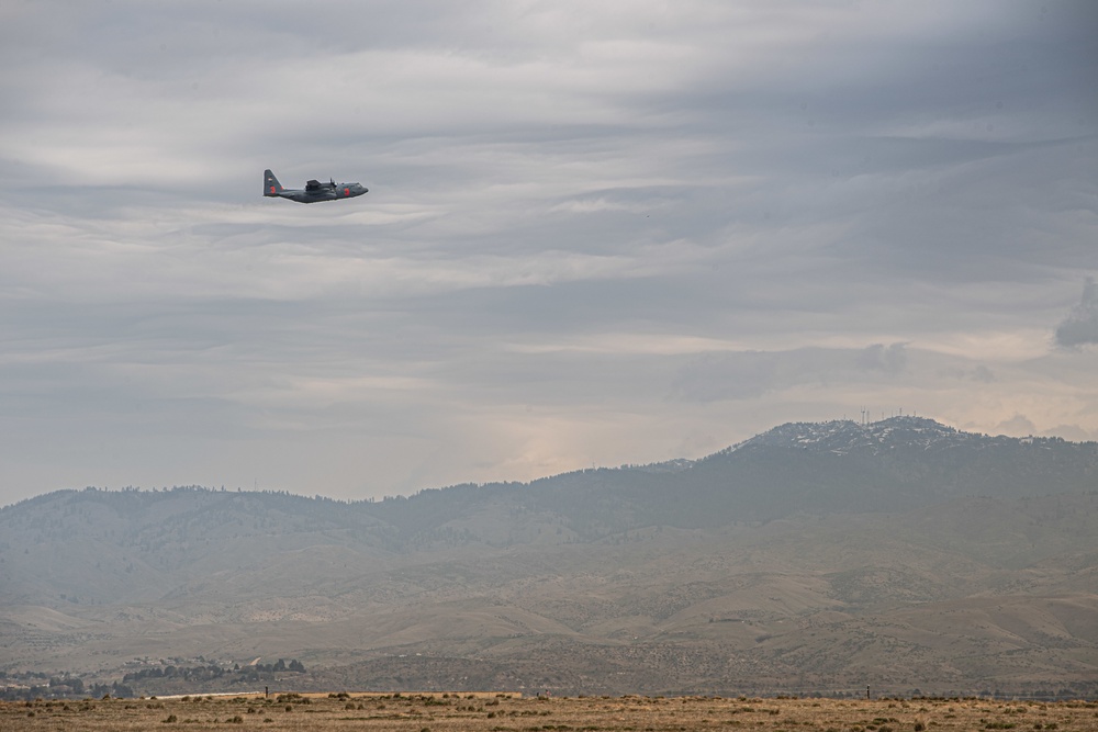 A C-130 from the 153d Airlift Wing equipped with USDA Forest Service MAFFS II (Modular Airborne Fire Fighting System)