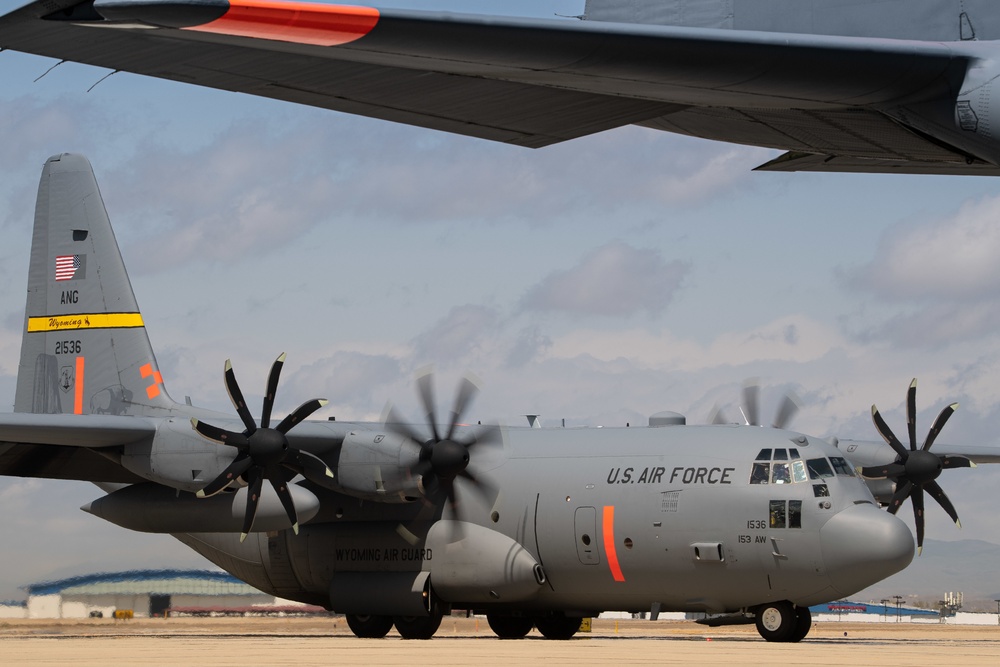 A C-130 from the 153d Airlift Wing equipped with USDA Forest Service MAFFS II (Modular Airborne Fire Fighting System)