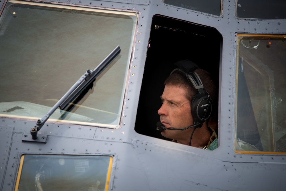 A C-130 from the 153d Airlift Wing equipped with USDA Forest Service MAFFS II (Modular Airborne Fire Fighting System)