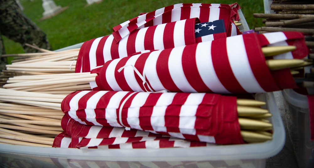 NMCP SAILORS PLACE MEMORIAL DAY FLAGS AT NSA HR-PA CEMETERY