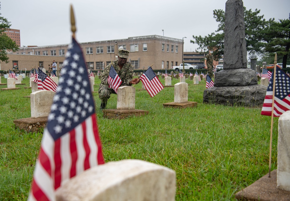 NMCP SAILORS PLACE MEMORIAL DAY FLAGS AT NSA HR-PA CEMETERY