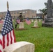 NMCP SAILORS PLACE MEMORIAL DAY FLAGS AT NSA HR-PA CEMETERY