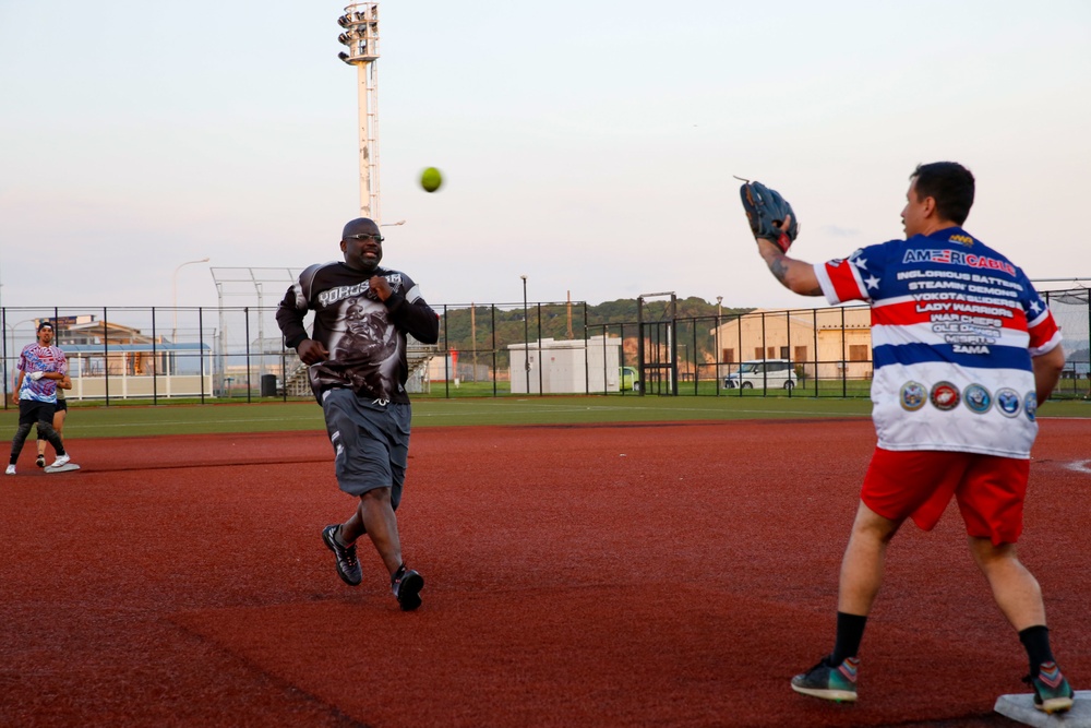 Abraham Lincoln Sailors participate in a MWR softball game