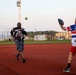 Abraham Lincoln Sailors participate in a MWR softball game