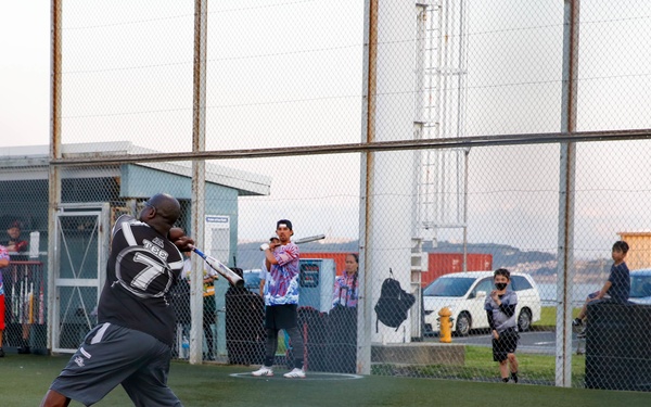 Abraham Lincoln Sailors participate in a MWR softball game