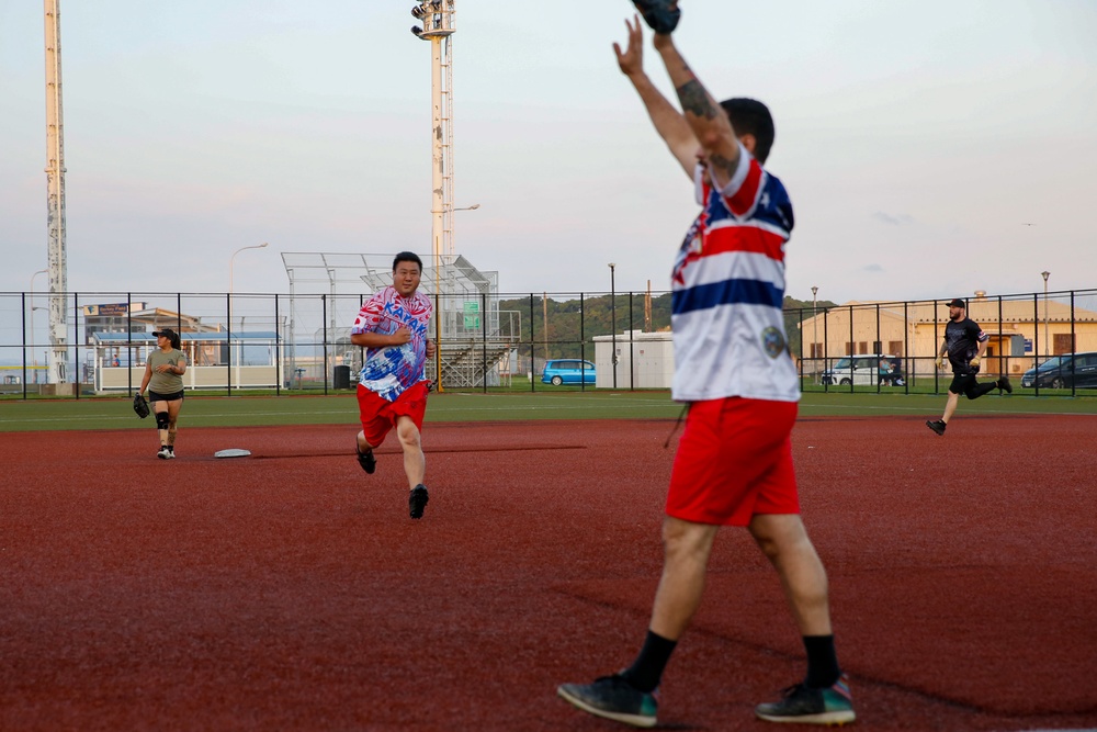 Abraham Lincoln Sailors participate in a MWR softball game