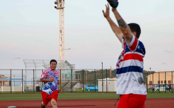 Abraham Lincoln Sailors participate in a MWR softball game