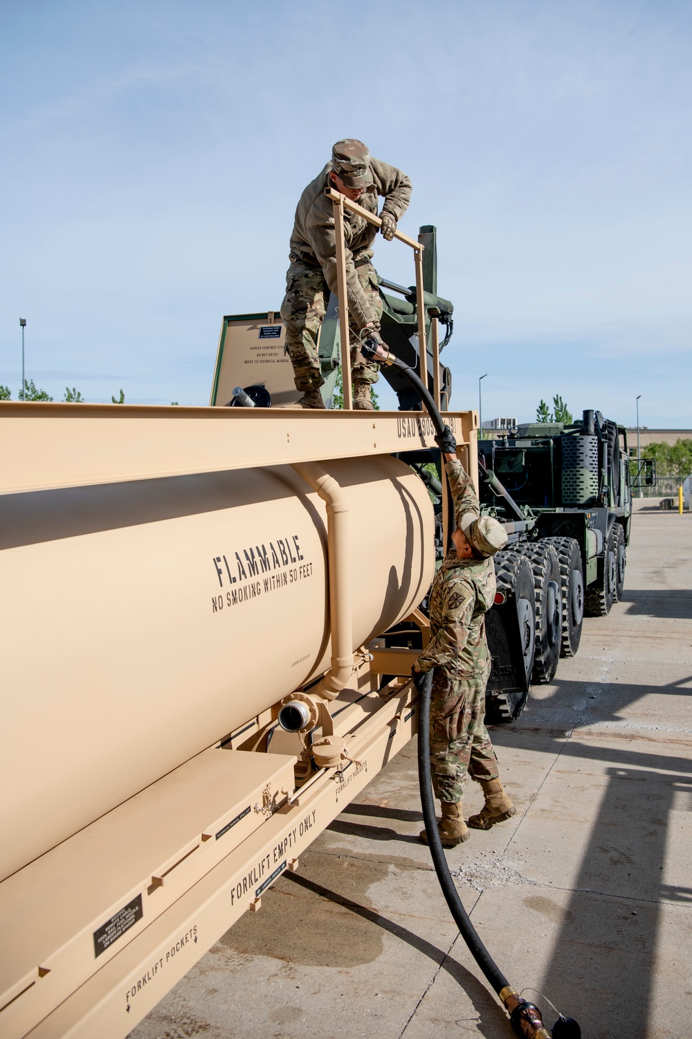 Michigan National Guard members maintain a modular fuel system tank rack module