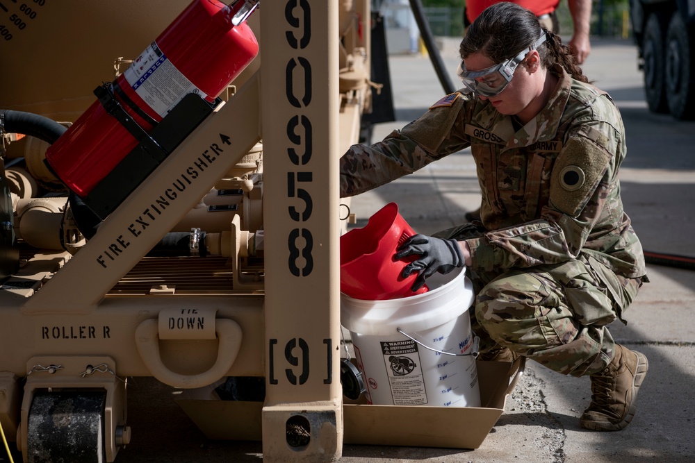 Michigan National Guard members maintain a modular fuel system tank rack module