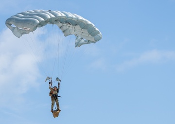 The U.S. Army Special Operations Command parachute team jumps in Miami for Hyundai Air and Sea Show