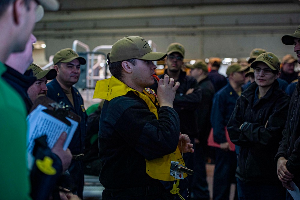 Sailors Assemble For Training During Abandon Ship Drill