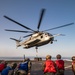 Helicopter support team training aboard USS Arlington
