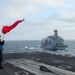 Sailors Signal USNS Henry J. Kaiser