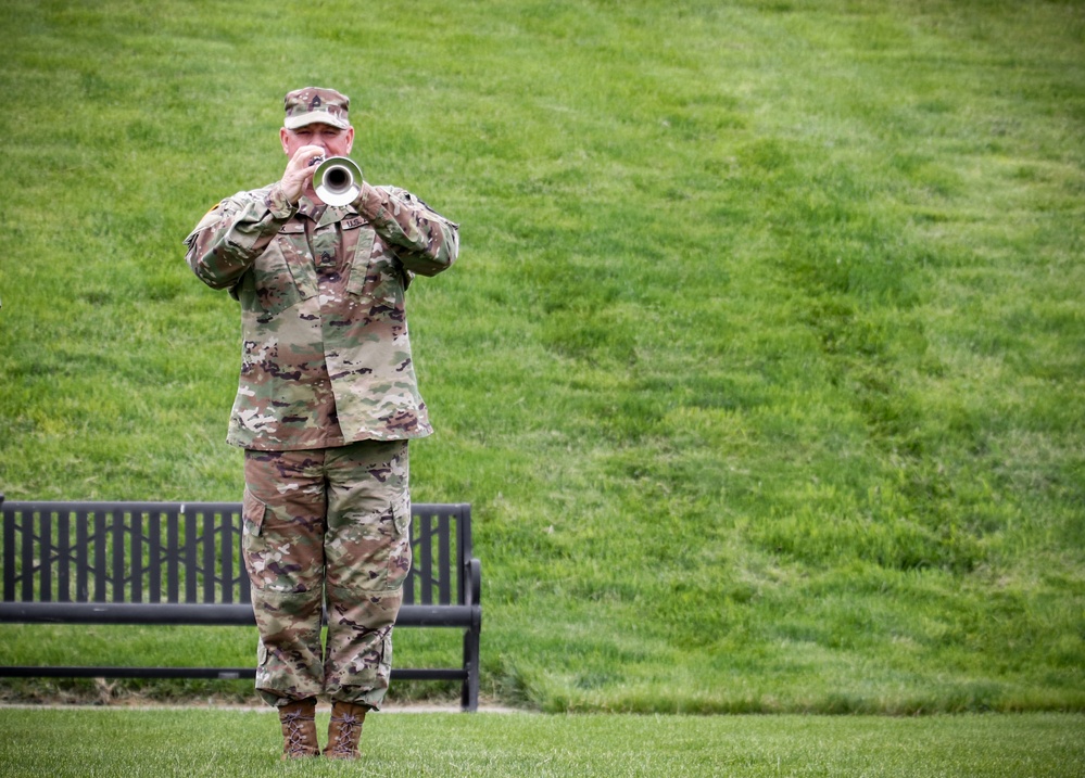 Iowa Soldier sounds reveille during annual command retreat