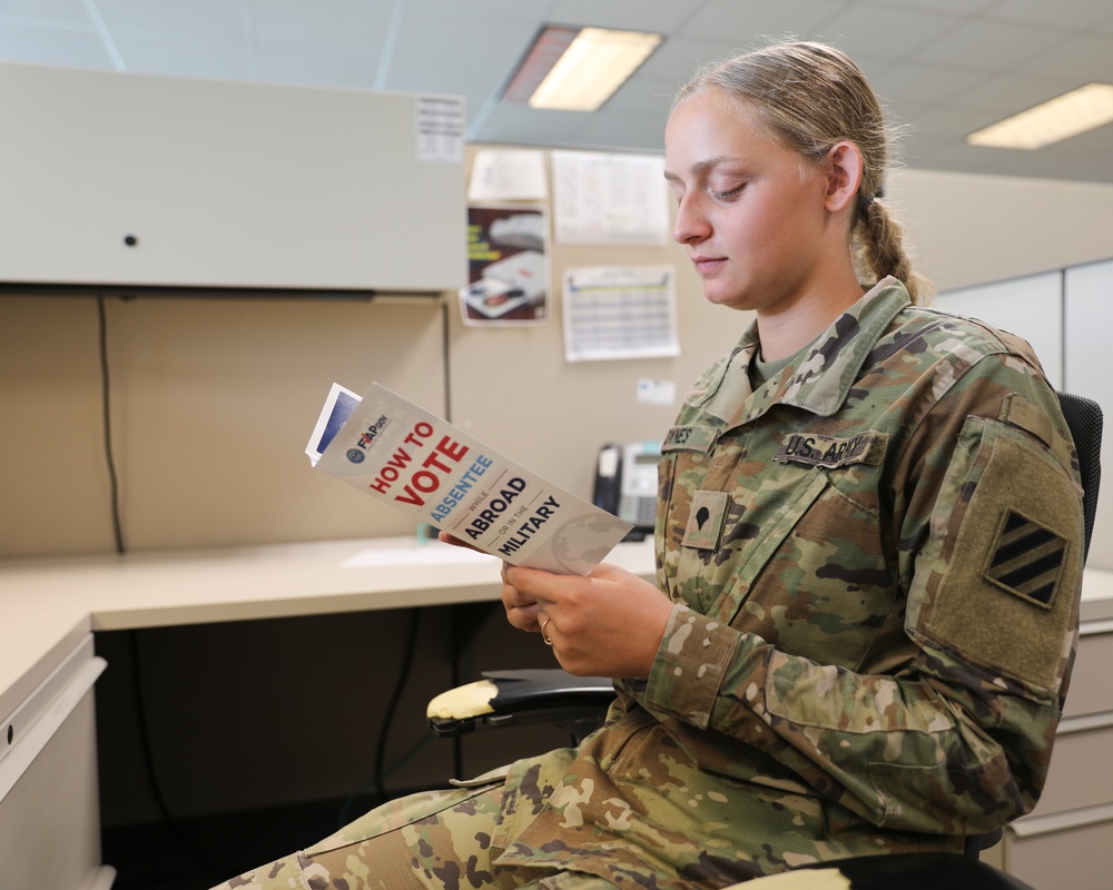 Dogface Soldier reads FVAP brochure