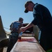 USS Carl Vinson (CVN 70) Sailor Paints Anchor