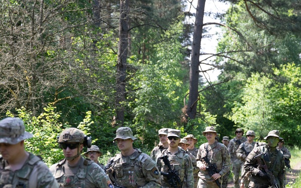 eFP Battle Group Poland Troops Train Together During Wet Gap Crossing Exercise
