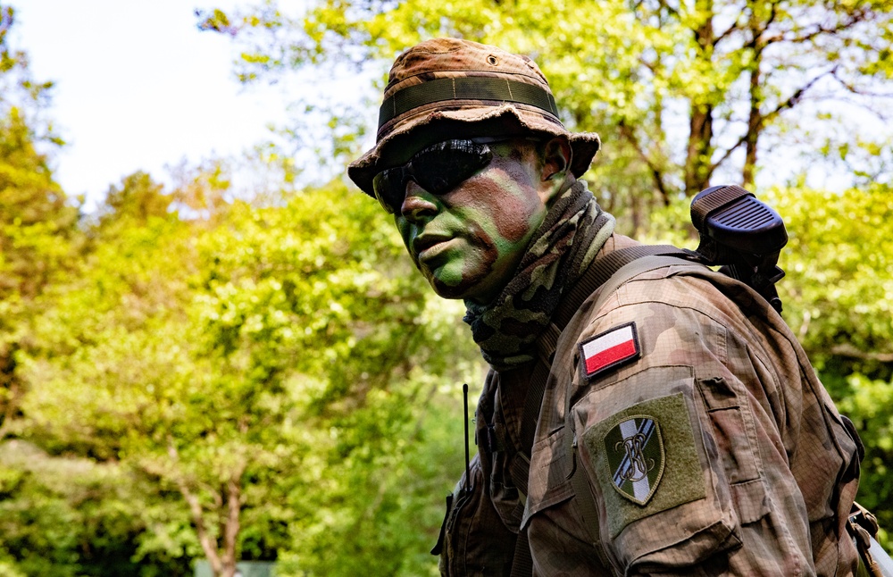 eFP Battle Group Poland Troops Train Together During Wet Gap Crossing Exercise